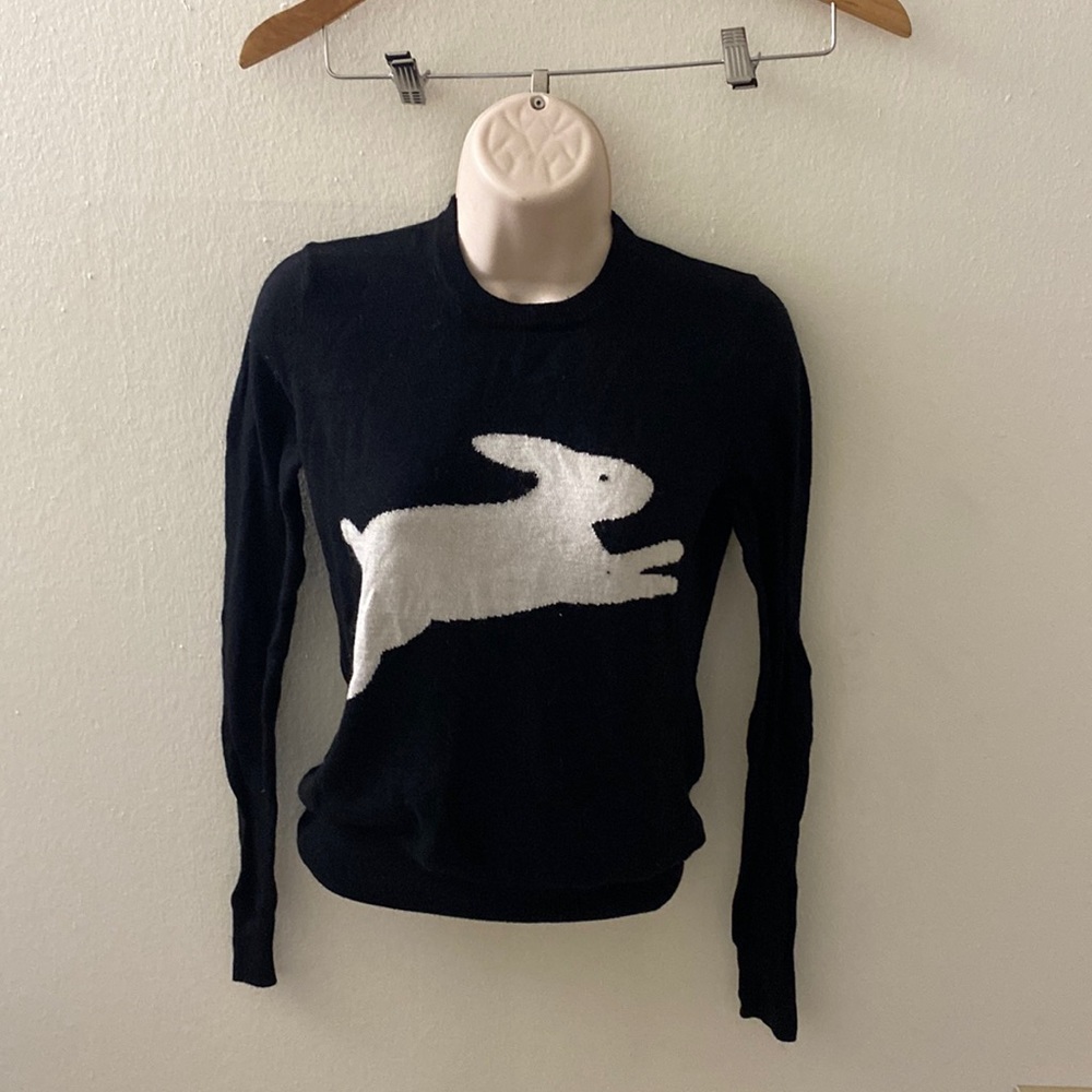 Long sleeved shirt Alice in wonderland themed.